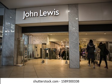 Newcastle / Great Britain - December 14, 2019 : Shopping customers entering John Lewis department store inside shopping centre mall setting