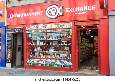 Newcastle / Great Britain - February 27, 2019: Exterior Of CEX Secondhand Entertaiment Exchange Showing Company Logo, Sign And Branding.  Window Display Of Technology And Electronics For Sale