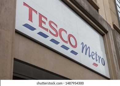 Newcastle / Great Britain - May 11, 2019 : Exterior Of Tesco Metro Supermarket And Grocery Shop.  Showing Logo, Sign, Signage And Branding Of Company Branches