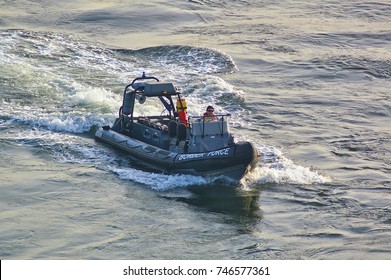 Newcastle, United Kingdom - October 5th, 2014 - UK Border Force RIB Patrol Boat With Crew Member