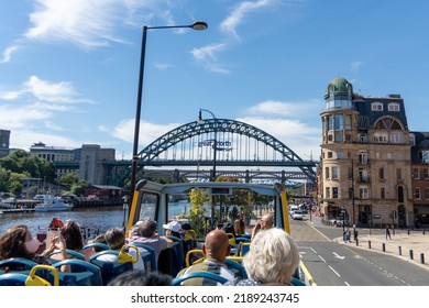 Newcastle upon Tyne, UK: August 9th, 2022: Travelling around the city on the open top Toon Tour sightseeing bus on a sunny day.
