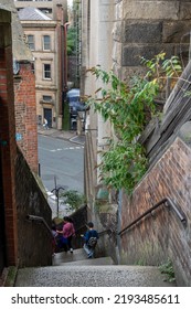 Newcastle Upon Tyne, UK: August 23rd, 2022: A Family Walk Down The Famous Dog Leap Stairs In The City.