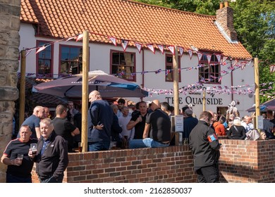 Newcastle Upon Tyne, UK - May 28th, 2022: The Traditional Pub Exterior And People Drinking Outside Of The Wetherspoons Quayside Bar On A Sunny Day. 