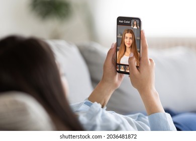 Newest Hairstyle Beauty Makeovers Mobile Applications Concept, Collage. Pretty Young Woman Using Hair Simulation Software On Smartphone While Relaxing On Couch At Home, Choosing Hair Color