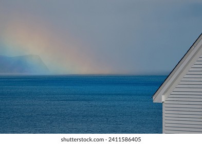 newfoundland Cape Spear Lighthouse Building and Colorful Rainbow offshore