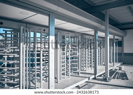 Newly built access control security gate. Prefabricated security turnstile at construction site. Protected entrance gate
