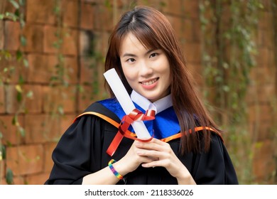 Newly College Graduated LGBT Person Holding Honored Degrees, Concept Of Equal Education Opportunity For All Non-binary LGBT People