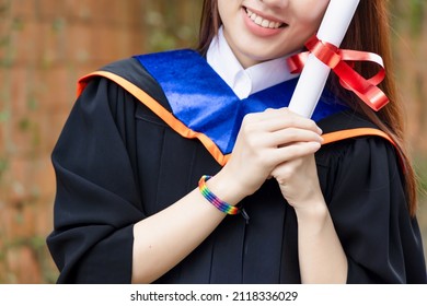 Newly College Graduated LGBT Person Holding Honored Degrees, Concept Of Equal Education Opportunity For All Non-binary LGBT People