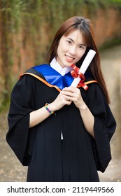 Newly College Graduated LGBT Person Holding Honored Degrees, Concept Of Equal Education Opportunity For All Non-binary LGBT People