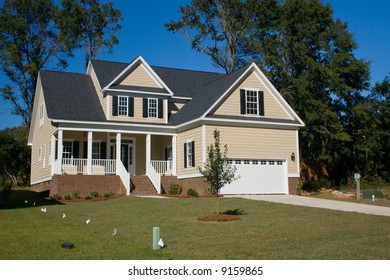 Newly Constructed Home With 3 Types Of Siding Brick, Vinyl And Shakes