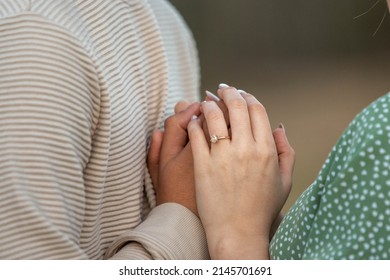 Newly Engaged Couple Holding Hands