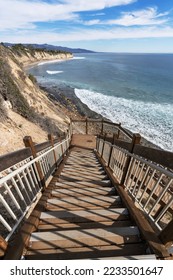 Newly improved staircase leading down to remote Dume Cove beach surf area in Malibu, California.  Vertical view. - Shutterstock ID 2233501647