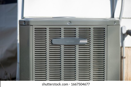 A newly installed air conditioner with no logos. - Shutterstock ID 1667504677