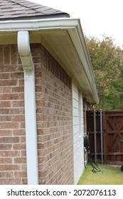 Newly Installed Seamless Gutter On The Side Of The House