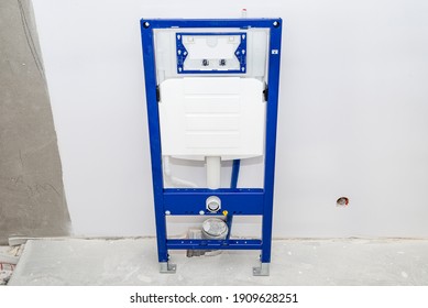 Newly installed WC concealed frame for wall-mounted toilet, screwed to the wall and floor.