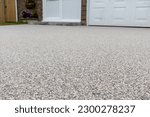 Newly laid resin driveway in front of a detached residential property