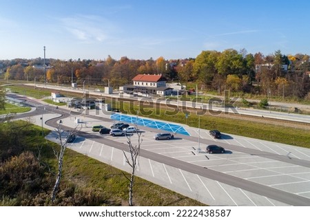 Newly modernized small railway station in Swoszowice district in Krakow, Poland, for fast city trains and regional passengers transportation. Big park and ride P+R incentive parking lot and bus stop Stock fotó © 