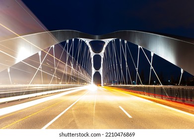 The newly opened Osthafenbrücke in Frankfurt am Main in a night shot with artificial lighting - Shutterstock ID 2210476869