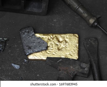 Newly poured gold ingot from the crucible, gold bar