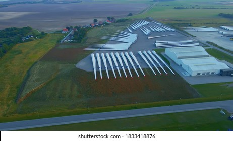 Newly Produced Wind Turbine Blades Made From Carbon, In Storage Ready For Shipping.