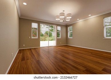 Newly Remodeled Room Of House with Finished Wood Floors, Moulding, Paint and Ceiling Lights. - Shutterstock ID 2132466727