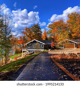 A Newly Renovated Home On Beautiful Walloon Lake In The Autumn With Colorful Leaves On The Trees In Northern Michigan.