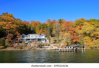 A Newly Renovated Home On Beautiful Walloon Lake In The Autumn With Colorful Leaves On The Trees In Northern Michigan.