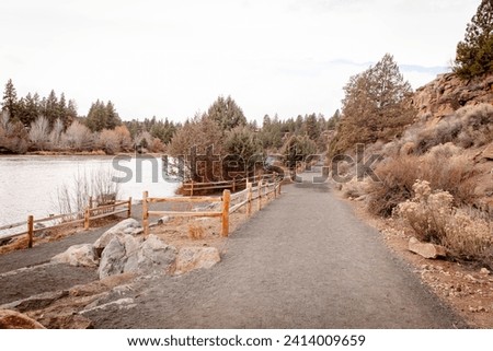 Newly renovated Old Mill Reach of Deschutes River Trail in Bend, Oregon. A popular hiking and running trail along a river in Bend. No snow winter, no people