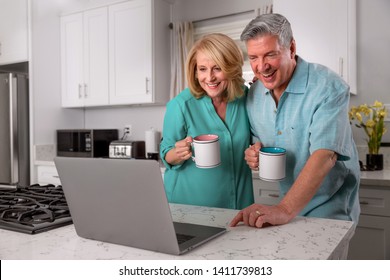 Newly Retired Couple Home With Coffee And Computer, Possibly Video Conference Call Chat With Friends