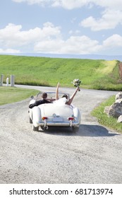 Newlywed Bride And Groom Drive Away In Getaway Car After Wedding