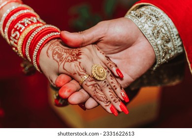 Newlywed couple holding hands together, Bride and Groom Hands - Powered by Shutterstock