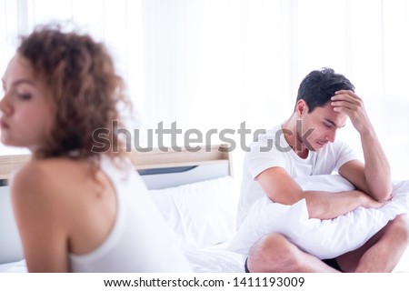 Newlywed have a fight in bed. The couple having difficulties in relationship. Wife always sulking & husband get angry easily. He has problem with erection. Domestic violence & Infertility concept. 