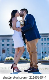 Newlywed Latin Couple Kissing, Low Angle View