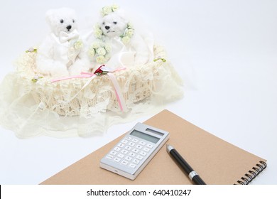 Newlyweds And Calculator On White Background.
Wedding Budget Concepts. 