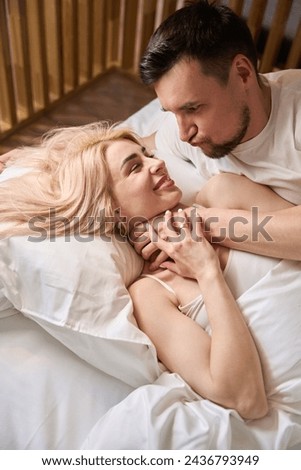 Newlyweds are having fun fooling around in bed