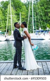 Newlyweds On Dock At Marina About To Kiss, Happy Millennial Couple At A Pier