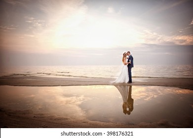 Newlyweds on the shore - Powered by Shutterstock