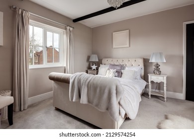 Newmarket, Suffolk - March 11 2019: Beautiful Stylish Luxury Bedroom Dressed With Stylish Furniture And Soft Furnishings Including Faux Fur Bedspread