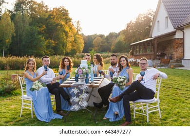 The newmarried couple and guests enjoy themselves at the Banquet table
