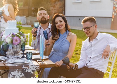 The newmarried couple and guests enjoy themselves at the Banquet table