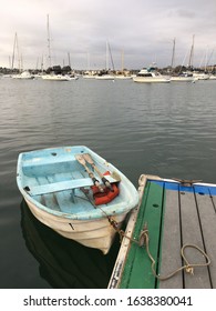 Newport Beach, CA, USA May 2, 2018 A Small Dinghy Is Moored To A Dock Near Yacht Marina In Newport Beach, California 