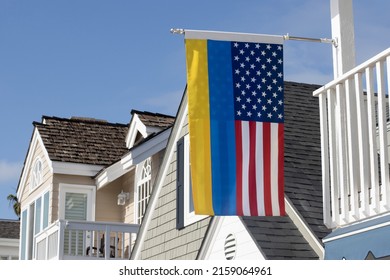 Newport Beach, CA, USA - May 8, 2022: A Combined American And Ukrainian Flag Is Seen Hanging Out In Front Of A House On The Balboa Island In Newport Beach, California, Showing Support For Ukraine.