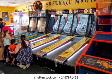 Newport Beach, California/United States - 07/15/19: A Family Play A Round Of Skee Ball At An Arcade