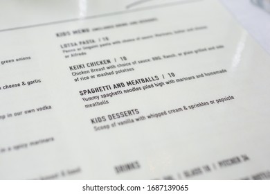 Newport Beach, California/United States - 07/30/2019: A closeup view of a spaghetti and meatballs item selection on a restaurant menu.
