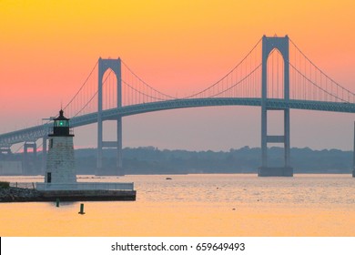 Newport Harbor Lighthouse And The Newport Bridge At Sunset, Located In The Narragansett Bay. Newport Is An International Sailing And Tourist Destination. New England Coastal Town. Travel, Vacation 