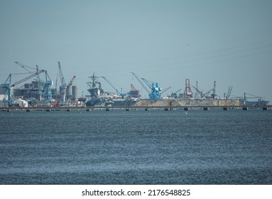 Newport News, Virginia, April 6 2022: View Of The Newport News Shipyard From James River. 