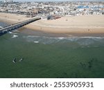 The Newport Pier and Beach with the Pacific Ocean from a UAV Aerial Drone