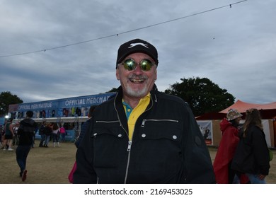 Newport, UK-June 19 2022: Isle Of Wight Music Festival Faces, Happy Festive People At The Mainstage And Festival Grounds On Sunday