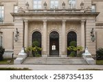 Newport, USA - September, 17th, 2015: Two sphynx at the beautiful entrance of the Elms gilded age historic mansion at Bellevue avenue in Newport, Rhode Island, USA