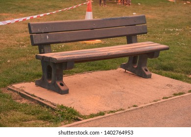 Newport Wales UK 05/19/2019  Charity Fun Run At Tredegar Park. Kolor Dash- Coloured Powder Paint Similar To People Being Covered With Powder At Holi Festival. Park Bench Covered In Orange Power Paint.